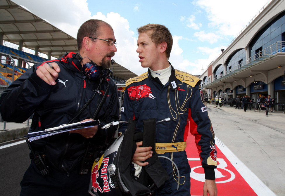 Andrea Landi y Sebastian Vettel