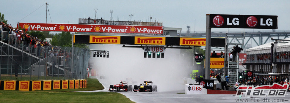 Alonso y Vettel en la salida del GP de Canadá 2011