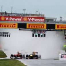 Alonso y Vettel en la salida del GP de Canadá 2011