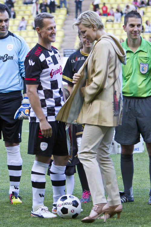 Michael Schumacher y la Princesa Charlene de Mónaco en el campo