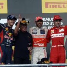 El podio del GP de Estados Unidos 2012 con Mario Andretti