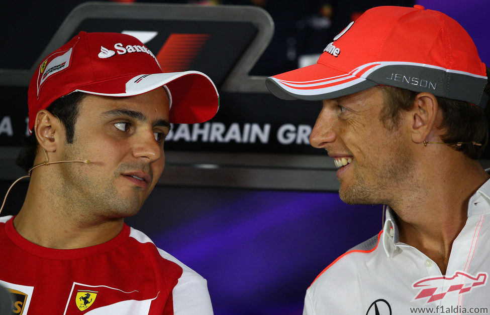 Felipe Massa y Jenson Button en la sala de prensa