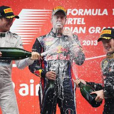 Nico Rosberg, Sebastian Vettel y Romain Grosjean en el podio