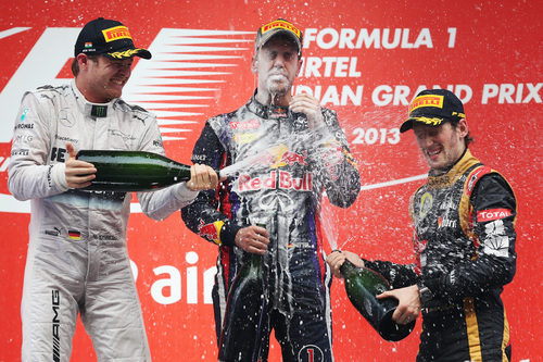 Nico Rosberg, Sebastian Vettel y Romain Grosjean en el podio