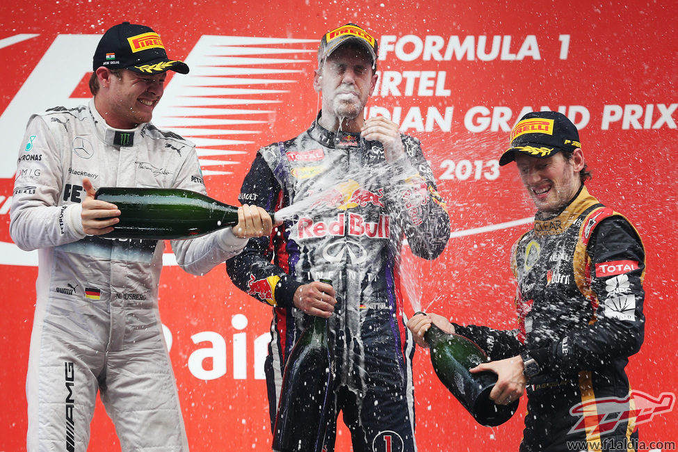 Nico Rosberg, Sebastian Vettel y Romain Grosjean en el podio