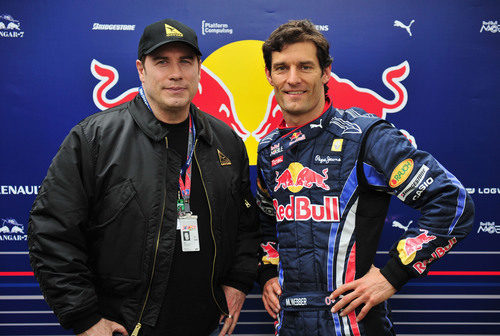 John Travolta y Mark Webber en el GP de Australia 2010