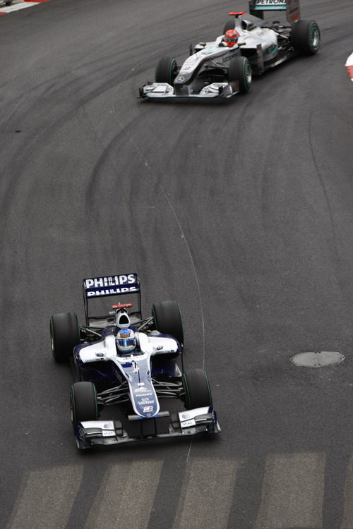 Rubens perseguido por Schumacher