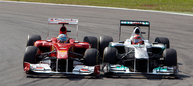Fernando Alonso y Michael Schumacher en Monza