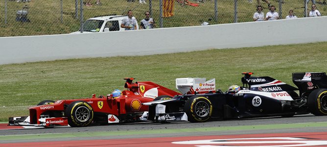 Fernando Alonso y Pastor Maldonado en el GP de España 2012