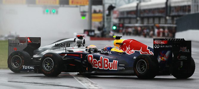 Mark Webber y Lewis Hamilton en Canadá 2011