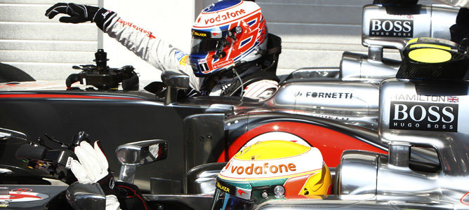 Jenson Button y Lewis Hamilton tras la clasificación de Hungría 2012