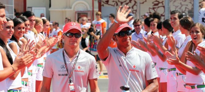 Heikki Kovalainen y Lewis Hamilton