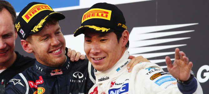 Kamui Kobayashi saluda al público junto con Sebastian Vettel