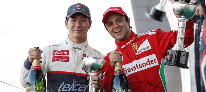 Kamui Kobayashi y Felipe Massa en el podio de Japón 2012