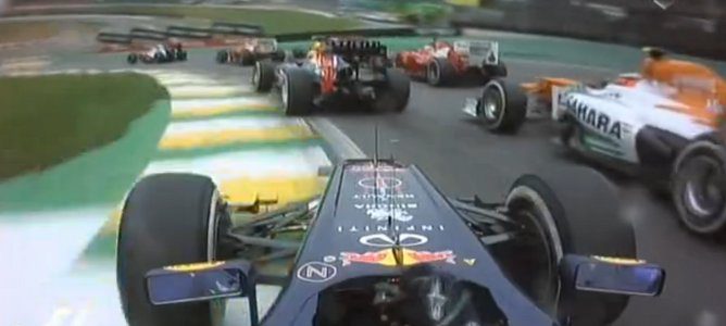 Vettel en la primera curva, superado por Alonso y Hulkenberg